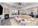 Elegant living room with coffered ceiling, fireplace, and views to the backyard at 14018 Promenade Dr, Huntersville, NC 28078