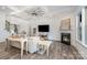 Comfortable living room featuring a fireplace, hardwood floors, and an open layout at 14018 Promenade Dr, Huntersville, NC 28078