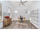 Spacious and bright office with neutral colors, a wood desk, and custom built in shelving at 14018 Promenade Dr, Huntersville, NC 28078