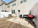 Shot of backyard concrete patio, with fencing, grass, and view of exterior of home at 14041 Castle Nook Dr # 75, Charlotte, NC 28273