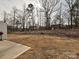 Image shows expansive backyard featuring grassy area with treeline in the background at 14041 Castle Nook Dr # 75, Charlotte, NC 28273