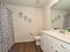 Well-lit bathroom with white vanity, modern fixtures, and a shower/tub combo with stylish curtain at 14041 Castle Nook Dr # 75, Charlotte, NC 28273