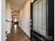 Inviting entryway featuring beautiful wood flooring and a stylish front door with decorative glass at 14041 Castle Nook Dr # 75, Charlotte, NC 28273