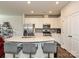 Modern kitchen features stainless steel appliances, granite counters, and island with barstool seating at 14041 Castle Nook Dr # 75, Charlotte, NC 28273