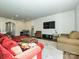 Comfortable living room with a flat-screen TV, plush seating, and stylish decor at 14041 Castle Nook Dr # 75, Charlotte, NC 28273