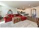 Spacious living room featuring a plush rug, a large sectional, and open access to the kitchen at 14041 Castle Nook Dr # 75, Charlotte, NC 28273