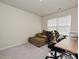 Office space featuring a window with blinds, desk, printer, and a comfortable lounge chair with ottoman at 14041 Castle Nook Dr # 75, Charlotte, NC 28273