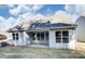 Back of house shows a patio with multiple windows to let in ample sunlight at 148 Prestwick Way # 21, Mooresville, NC 28115
