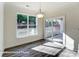 Bright dining area with sliding glass door leading to the backyard and large windows offering ample natural light at 148 Prestwick Way # 21, Mooresville, NC 28115