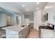 Spacious kitchen with stainless steel appliances, granite countertops, gray cabinets, and a large center island at 148 Prestwick Way # 21, Mooresville, NC 28115