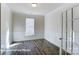 Office space with hardwood flooring, white walls with wainscoting and plenty of natural light at 148 Prestwick Way # 21, Mooresville, NC 28115