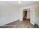 Office space with hardwood flooring, white walls with wainscoting and a view of the stairs at 148 Prestwick Way # 21, Mooresville, NC 28115