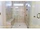 Stylish shower featuring marble-like tiling, a built-in seat, and a small window at 148 Prestwick Way # 21, Mooresville, NC 28115