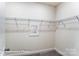Spacious walk-in closet with installed metal racks for optimal storage solutions at 148 Prestwick Way # 21, Mooresville, NC 28115