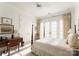 Well-lit bedroom with a queen bed and French doors leading to a balcony at 186 Cherokee Rd, Charlotte, NC 28207