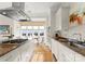 Modern kitchen with stainless steel appliances and granite countertops at 186 Cherokee Rd, Charlotte, NC 28207