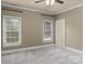 Well-lit bedroom with neutral walls and carpet at 208 Grasshopper Cir, Mooresville, NC 28117