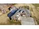 Aerial view of a house, detached garage, and expansive yard at 219 Society Rd, Statesville, NC 28625