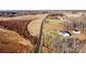 Aerial view of a house on a large lot with surrounding farm land at 219 Society Rd, Statesville, NC 28625