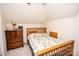 Upstairs bedroom with wooden bed frame and dresser at 219 Society Rd, Statesville, NC 28625
