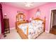 Bedroom with full-size bed and floral bedding at 219 Society Rd, Statesville, NC 28625