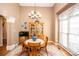 Bright dining room featuring wood table and hutch at 219 Society Rd, Statesville, NC 28625