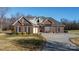 Charming brick home featuring a well-manicured lawn and inviting front entrance at 219 Society Rd, Statesville, NC 28625