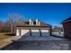 Detached three-car brick garage with dormer windows at 219 Society Rd, Statesville, NC 28625