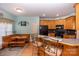 Eat-in kitchen with wood cabinets, breakfast bar, and modern appliances at 219 Society Rd, Statesville, NC 28625
