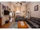Spacious living room with hardwood floors, comfortable seating, and a large TV at 219 Society Rd, Statesville, NC 28625