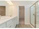 Bright bathroom boasts double sinks, walk-in shower, and linen closet at 2230 Catawba Trace Dr, Catawba, NC 28609
