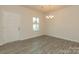 Simple dining room with light walls, hardwood floors, and a chandelier at 2230 Catawba Trace Dr, Catawba, NC 28609