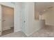 Upstairs hallway with linen closet and doors to bedrooms at 2230 Catawba Trace Dr, Catawba, NC 28609