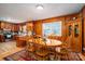 Dining area with wood paneled walls and a wooden table at 2264 Country Club Rd, Lincolnton, NC 28092