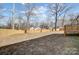 Large backyard with wooden fence and trees at 301 Tomberlin Rd, Mount Holly, NC 28120