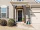 Inviting front door with decorative wreath and beautiful trim at 3029 Mendenhall St, Indian Trail, NC 28079