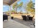 View of the outdoor patio featuring a grill and patio furniture overlooking a large backyard at 3029 Mendenhall St, Indian Trail, NC 28079