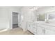 Bright bathroom with double vanity, tile floor, and walk-in closet access at 355 Miramar Dr, York, SC 29745