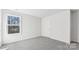 A bright bedroom with neutral carpet and a view to the outdoors from the window at 355 Miramar Dr, York, SC 29745