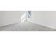A bright bedroom with neutral carpet and natural light from a large window at 355 Miramar Dr, York, SC 29745