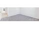A bright bedroom with neutral carpet and multiple doors and windows at 355 Miramar Dr, York, SC 29745