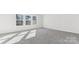 A bright bedroom with neutral carpet and natural light from multiple windows at 355 Miramar Dr, York, SC 29745