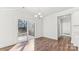 Dining room boasts wood floors, modern lighting, and sliding glass doors to the backyard at 355 Miramar Dr, York, SC 29745