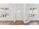 Bright entryway featuring a white front door, sidelight windows, and beautiful hardwood floors at 355 Miramar Dr, York, SC 29745