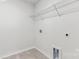 Bright laundry room with white walls and tile floor at 355 Miramar Dr, York, SC 29745