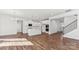 Open concept living area featuring a modern kitchen and staircase with hardwood floors at 355 Miramar Dr, York, SC 29745