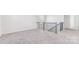 Open loft area features neutral carpet and railing at 355 Miramar Dr, York, SC 29745