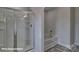 Bathroom with shower and tub, featuring modern fixtures and gray flooring at 3913 Coleman Dr, Charlotte, NC 28215