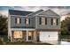 Two-story house with stone accents and a two-car garage at 3913 Coleman Dr, Charlotte, NC 28215