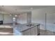 Modern kitchen island with granite countertops and stainless steel sink at 3913 Coleman Dr, Charlotte, NC 28215